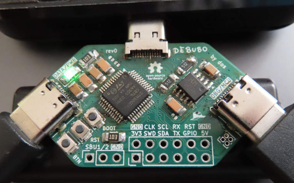 Photo of assembled Debubo plugged into a phone's USB-C port